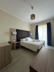 Postel nebo postele na pokoji v ubytování Adalesia Hotel & Coffee