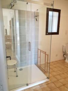 a shower with a glass door in a bathroom at Résidence Lou Cigaloun - ANA LOCATION in Gréoux-les-Bains