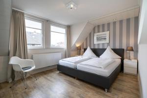 Ein Bett oder Betten in einem Zimmer der Unterkunft Süderliebe