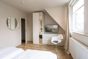 Ein Bett oder Betten in einem Zimmer der Unterkunft Süderliebe