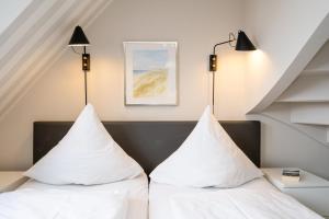 Ein Bett oder Betten in einem Zimmer der Unterkunft Süderliebe