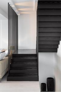 Postel nebo postele na pokoji v ubytování Black Stone Villa