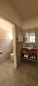 Koupelna v ubytování Harmony Self-Catering Apartments + 37 fotografií