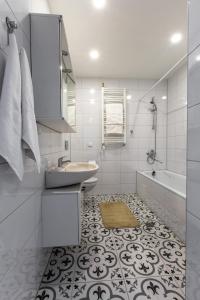 Kopalnica v nastanitvi Apartamentai Laima