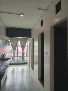 a hallway with a large window in a house at TEMPO EXT. in Semporna