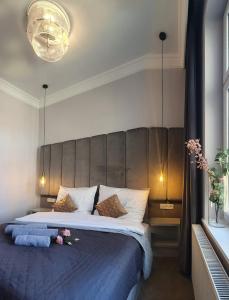 Llit o llits en una habitació de DK Premium Ballady i Romanse