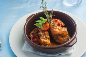 a bowl of food with meat and vegetables on a plate at Hotel Albatros in Ischia