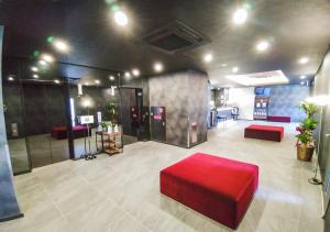 Postel nebo postele na pokoji v ubytování HOTEL LiVEMAX Kokura Ekimae