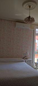 Łóżko lub łóżka w pokoju w obiekcie Hostal Romero