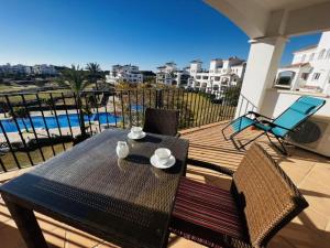 Een balkon of terras bij Haciënda Riquelme Golf Atlantico 2 bedroom apartment