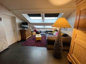 Televisyen dan/atau pusat hiburan di Appartement cosy avec jacuzzi à Plaimbois-du-Miroir, 70 m²