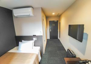 TV a/nebo společenská místnost v ubytování HOTEL LiVEMAX Kokura Ekimae