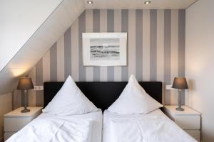 Ein Bett oder Betten in einem Zimmer der Unterkunft Süderliebe