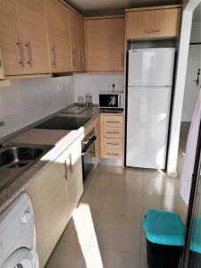A kitchen or kitchenette at MH28 - 2 Bedroom apartment, stunning sea views, large terraces in Isla Plana, Puerto de Mazarron