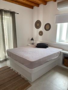 Ένα ή περισσότερα κρεβάτια σε δωμάτιο στο Levantes Villa Panagia beach