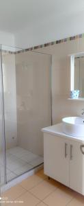 a white bathroom with a sink and a shower at Villa Andoni in Othonoi +20 photos