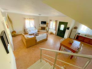 a large living room with a couch and a table at Villa Andoni in Othonoi