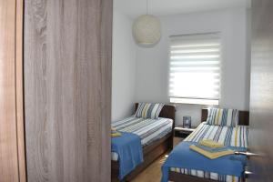Posteľ alebo postele v izbe v ubytovaní Apartment Vapor