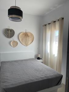 A bed or beds in a room at Voras Villa Panagia Beach