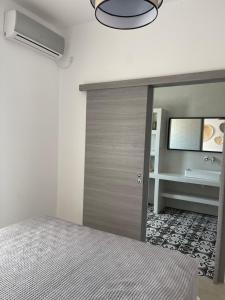 A bed or beds in a room at Voras Villa Panagia Beach
