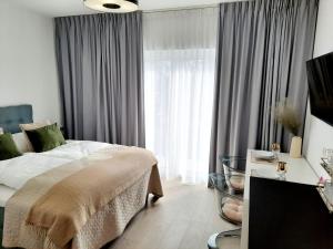 Postel nebo postele na pokoji v ubytování Apartamenty na Spokojnej