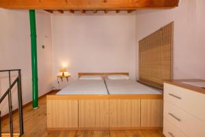 Ein Bett oder Betten in einem Zimmer der Unterkunft Family 1 - Bilocale con soppalco