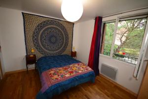 a bedroom with a bed and a window at Essentiel Barret in Barret-sur-Meouge +12 photos