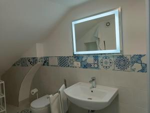 a bathroom with a sink and a mirror at Regina Margherita in Positano
