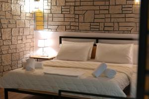 A bed or beds in a room at Oceanic Overview Suites