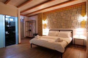 A bed or beds in a room at Oceanic Overview Suites