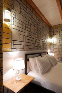 A bed or beds in a room at Oceanic Overview Suites