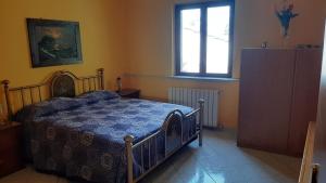 Posteľ alebo postele v izbe v ubytovaní Appartamento con giardino e parcheggio riservato