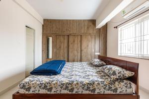 Llit o llits en una habitació de Pinnacle Serviced Apartments