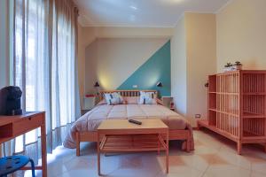 Postel nebo postele na pokoji v ubytování B&B CasaBuddace