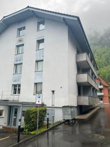 a building with balconies on the side of it at Zimmer Hergiswil in Hergiswil