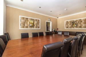 a conference room with a large table and chairs at Cherry Tree House in Blackpool