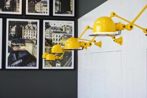 a painting of a yellow fire hydrant on a wall at Staycity Aparthotels Manchester Piccadilly in Manchester