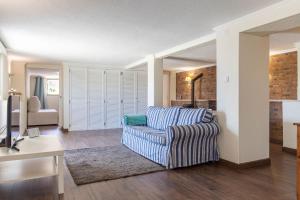 a living room with a couch and a table at Kochab Sintra by LovelyStay in Sintra