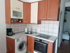 Kuchyň nebo kuchyňský kout v ubytování Apartman Adriana