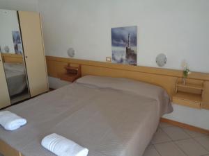 Postel nebo postele na pokoji v ubytování Hotel Gazza