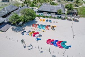 an aerial view of a beach with umbrellas in the sand at Rancho Do Peixe in Prea