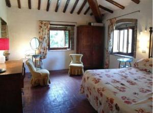Posteľ alebo postele v izbe v ubytovaní Antica casa colonica in pietra in Toscana