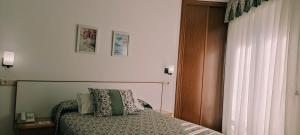 Łóżko lub łóżka w pokoju w obiekcie Hotel Grove