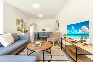 a living room with a couch and a table at Country Life Park in Johannesburg