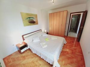 Łóżko lub łóżka w pokoju w obiekcie Iva apartman