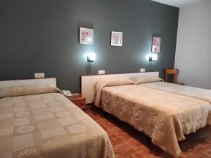 Łóżko lub łóżka w pokoju w obiekcie Hotel Grove