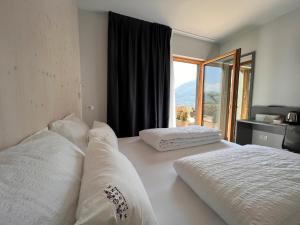 A bed or beds in a room at Agriturismo Margone