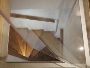 a view of a wooden staircase in a building at B&B Porto Del Bivio in Duino