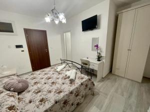 Postel nebo postele na pokoji v ubytování Donnabella house