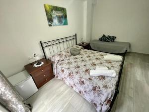 Postel nebo postele na pokoji v ubytování Donnabella house